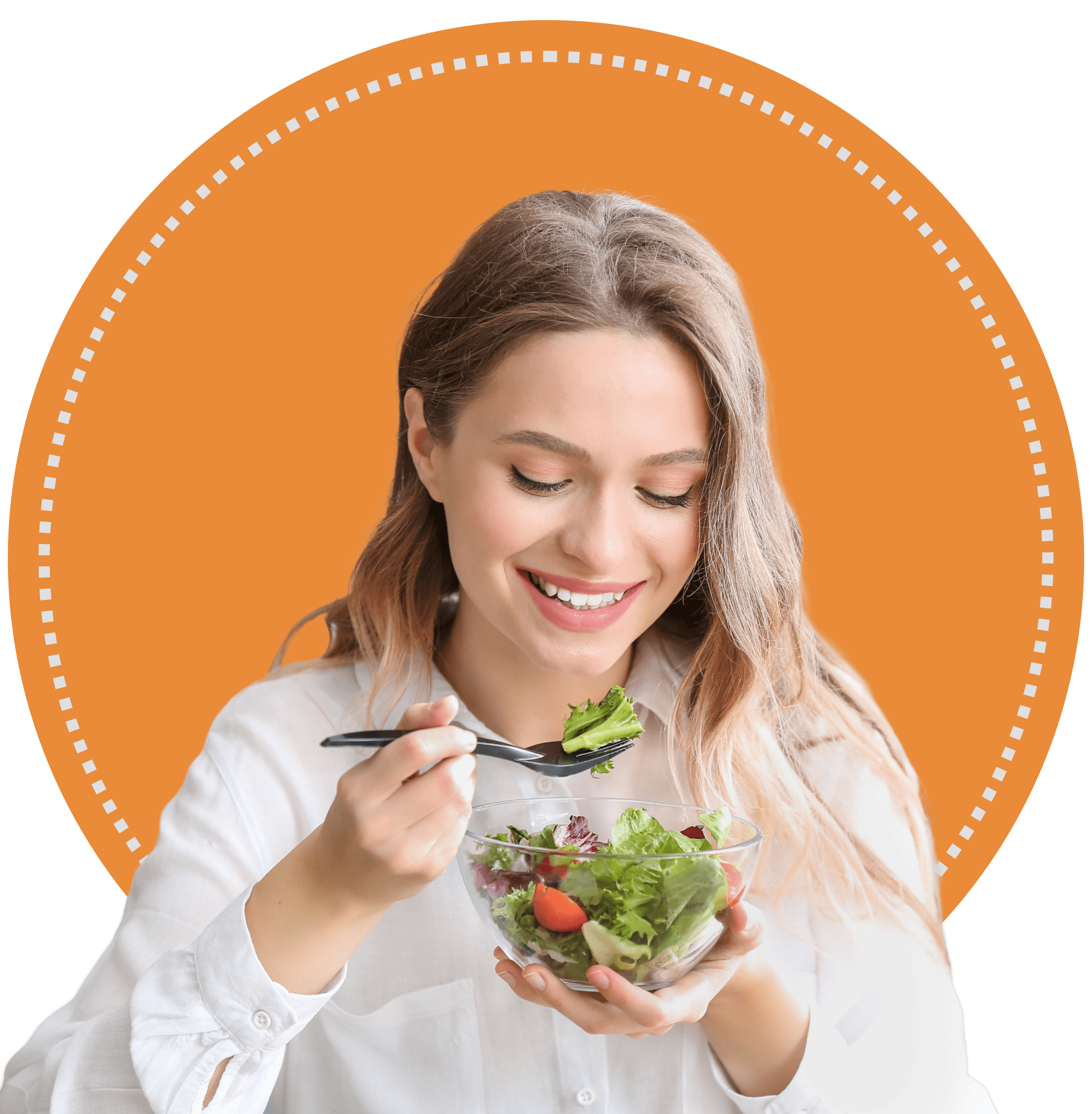 Smiling woman enjoying a fresh salad.